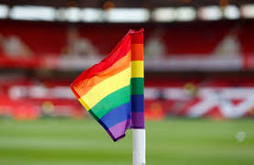 rainbow flag in front of grandstand at sports stadium