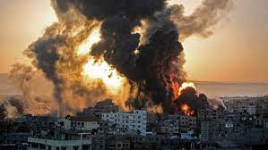 An aerial shot of the Gaza Strip in flames and smoke