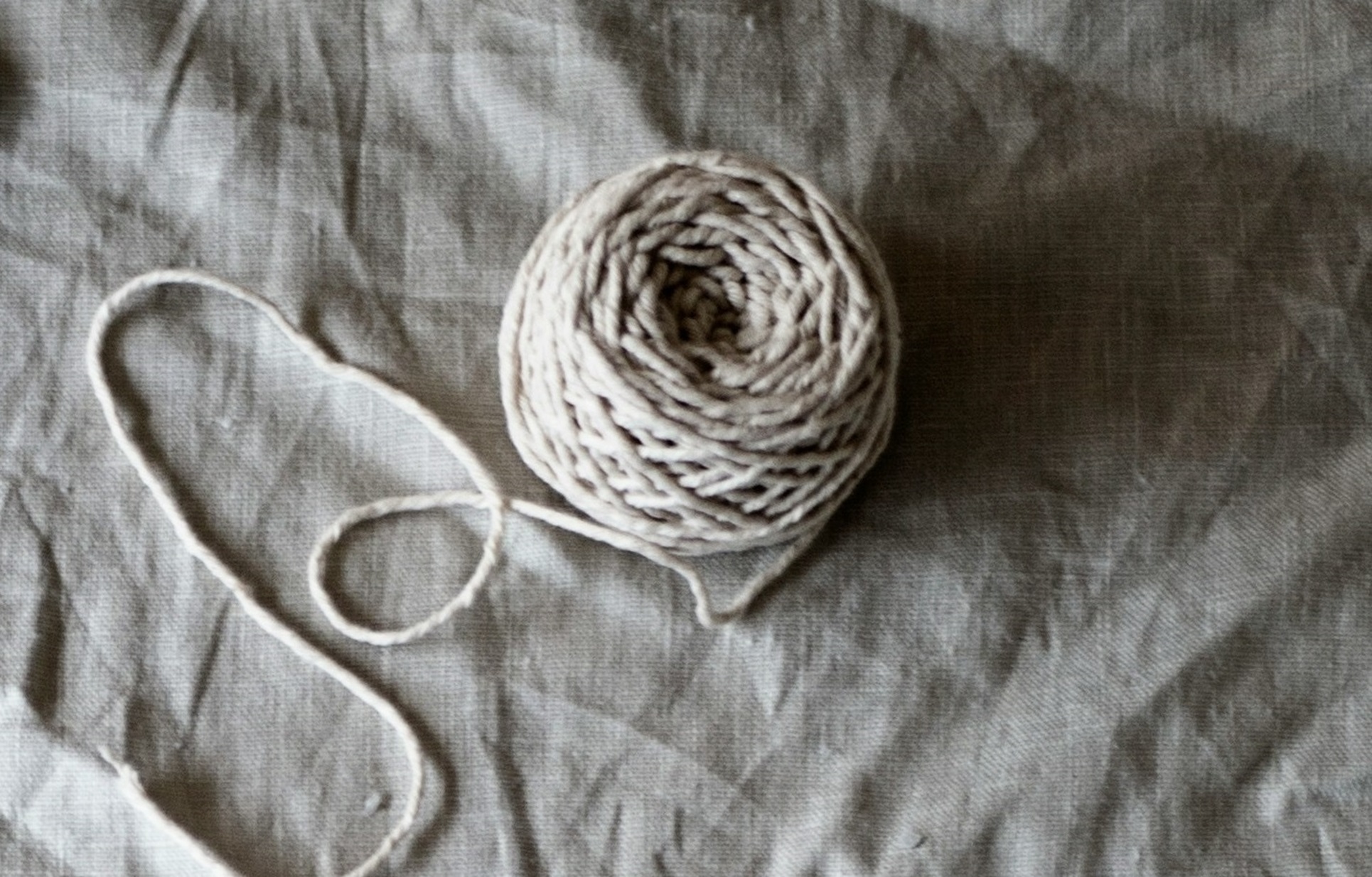 A ball of string on fabric