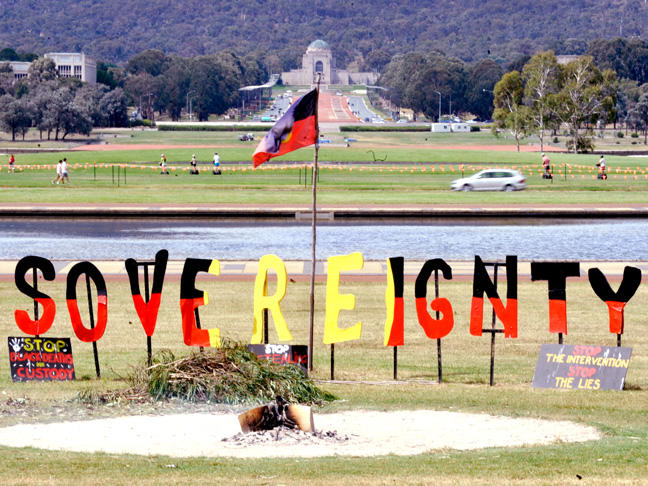 A coloured photograph of the sacred fire at the Aboriginal Tent Embassy in Canberra. Picture: AAP