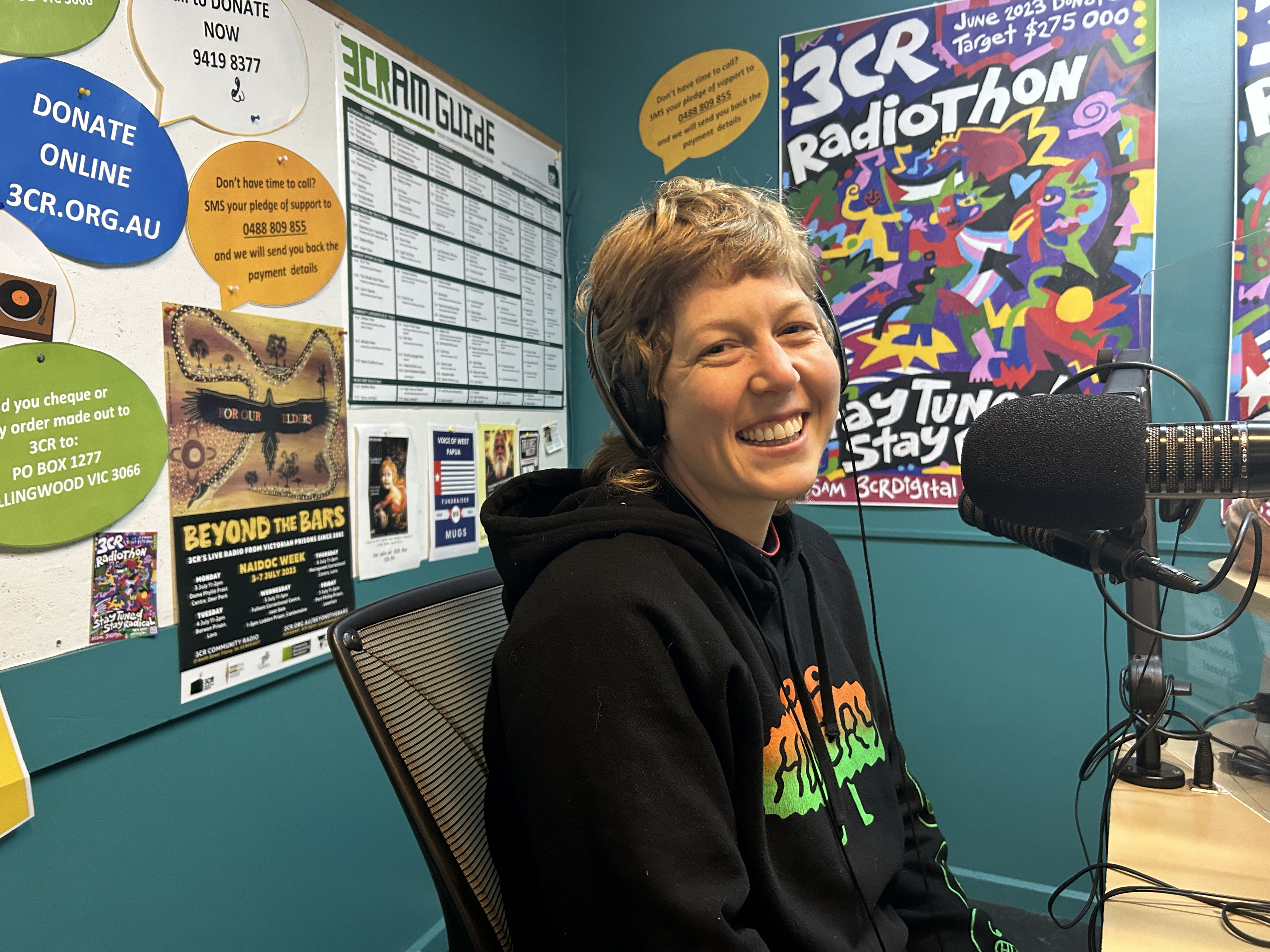 Annie Keynes sits in the 3CR studio