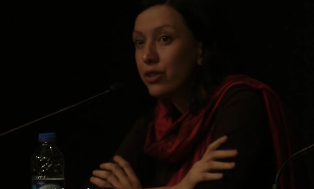 Rafeef Ziadah in the power of culture event in Berlin in front of mic