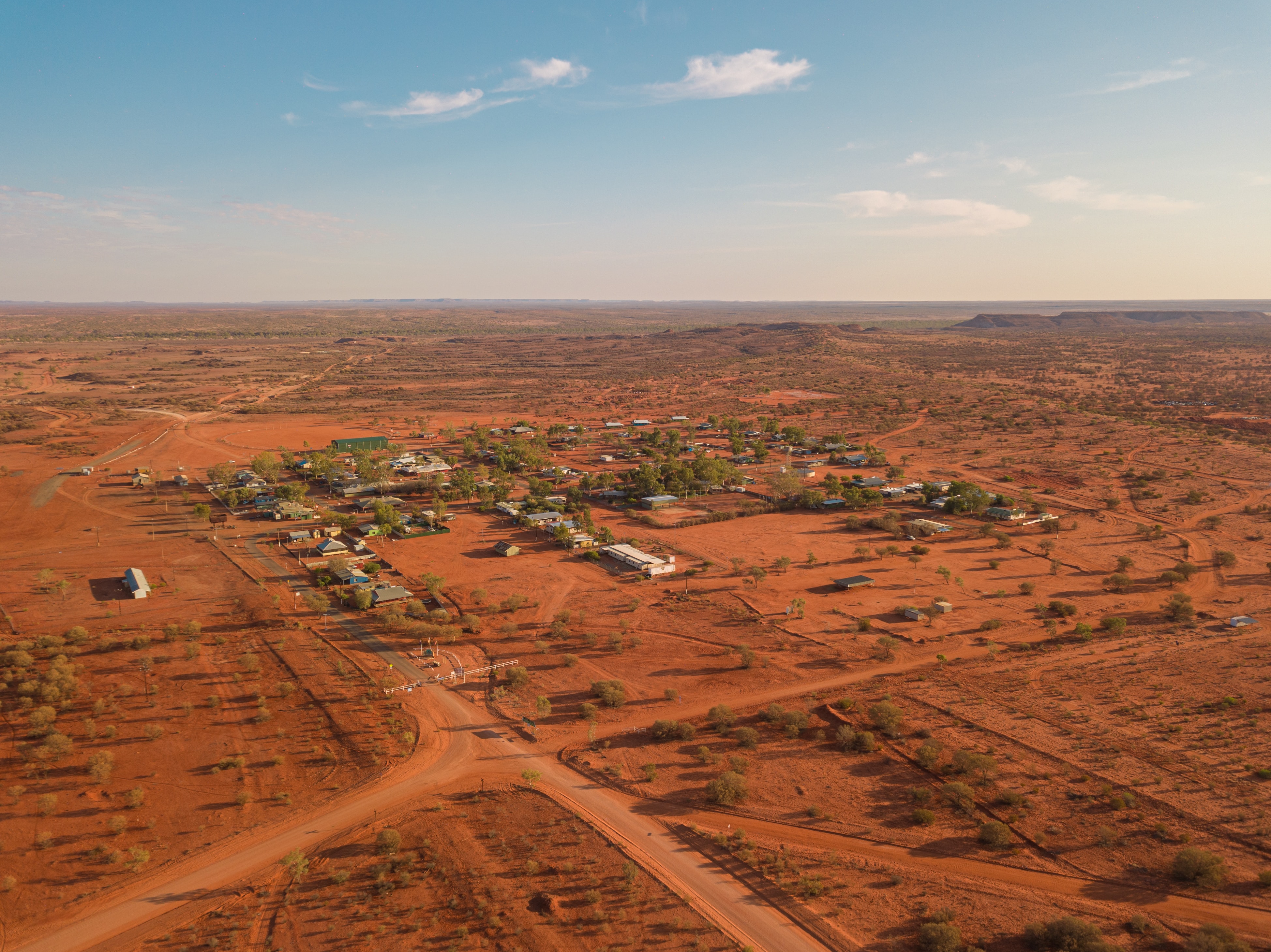 Aerial view of remote, outback town with red dirt