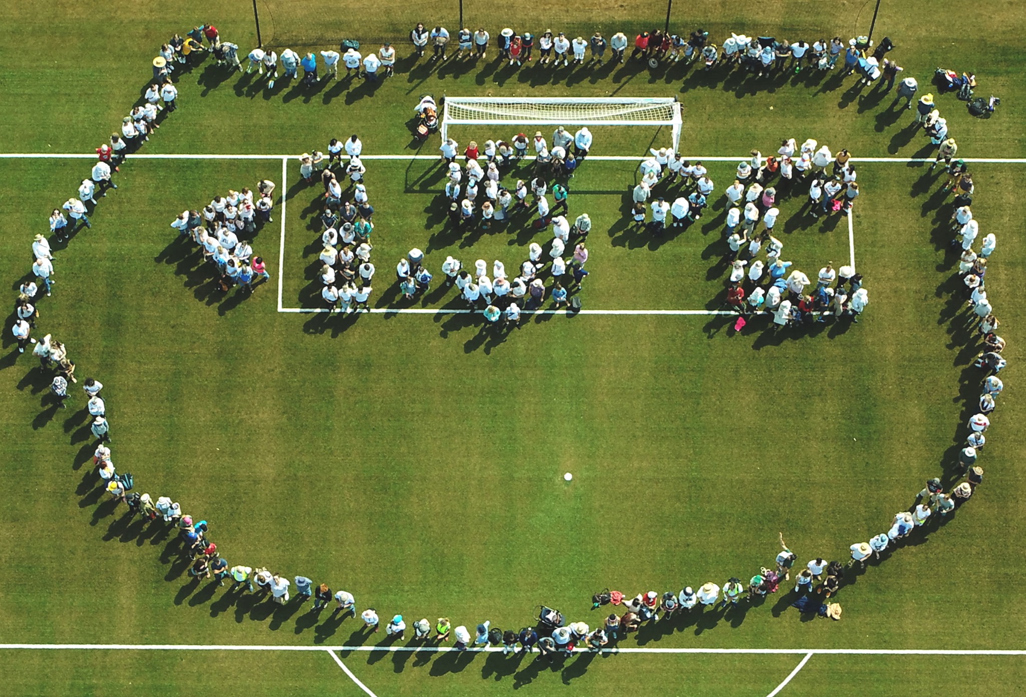 A Human sign calling for global warming to stay below 1.5 degrees