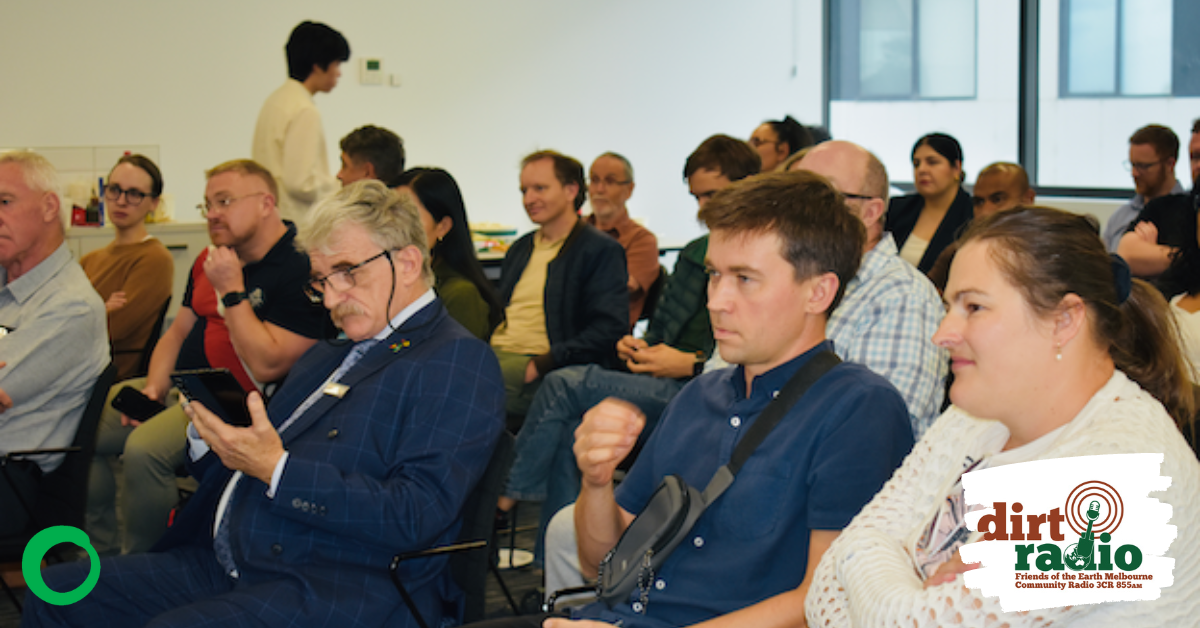 Image of audience members at watching a speaker at the community forum