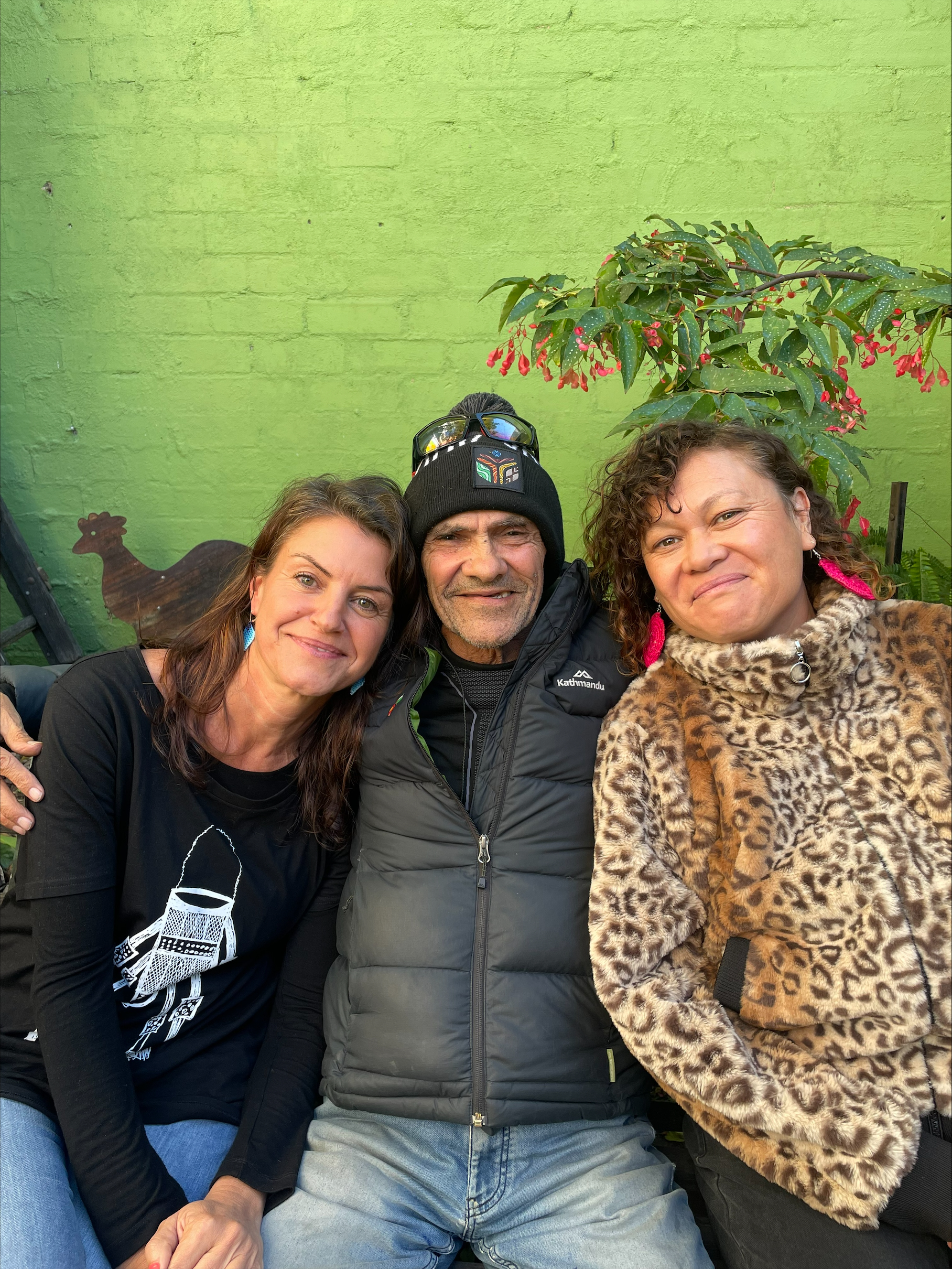 From left to right: photo of Sinem Saban, Uncle Robbie Thorpe, and Pania Edmons in the 3CR garden.