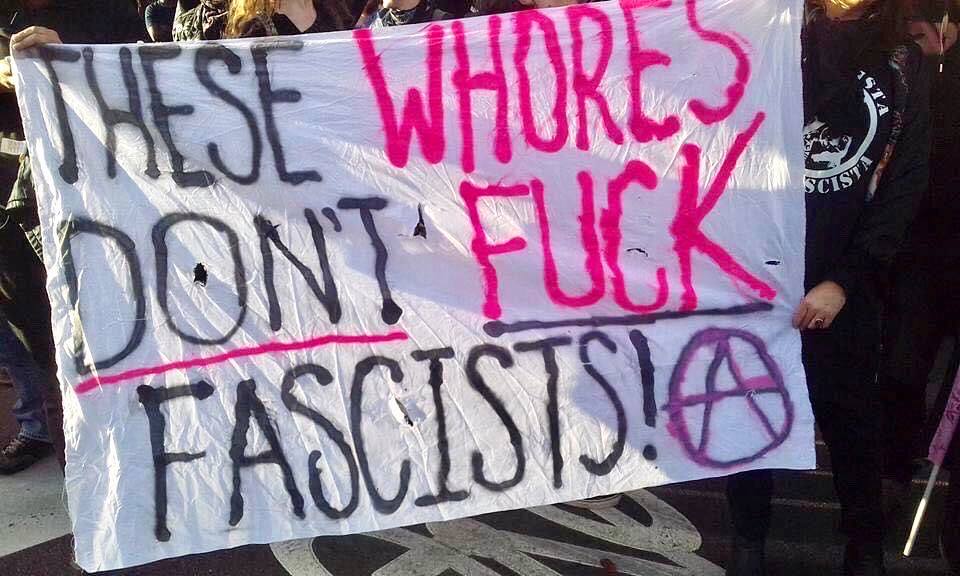 Antifascist sex workers at anti-Milo Yianopolis antifa protest, holding a banner reading "These Whores Don't Fuck Fascists" (circle A). Naarm/ Melbourne, 2018.