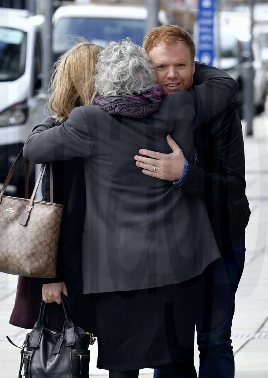 Richard Boyle receives a hug from supporter at Adelaide magistrates court hearing