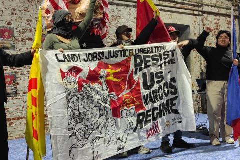 Anak Bayan members hold a banner which reads "Resist the US-Marcos Regime"