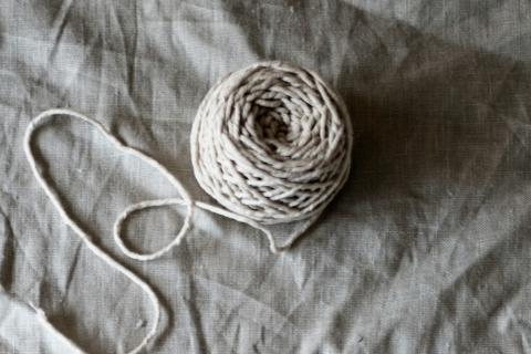 A ball of string on fabric