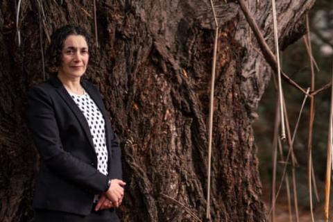 A picture of Dr Joelle Gergis standing near trees 