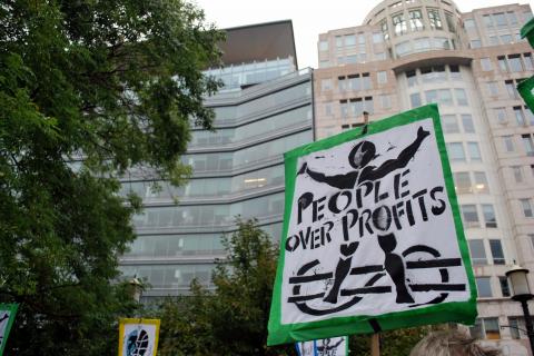 Sign at protest: People over profits