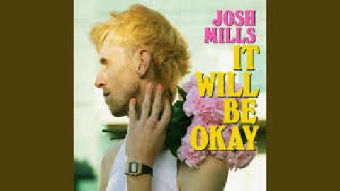 Josh Mills second single It Will be OK blond haired man light blue background ink yellow text