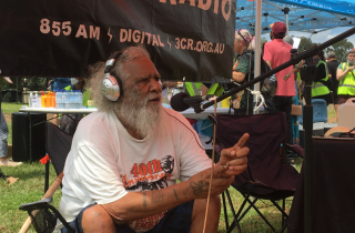 Talgium Edwards broadcasting from the Aboriginal Tent Embassy 50th Anniversary.