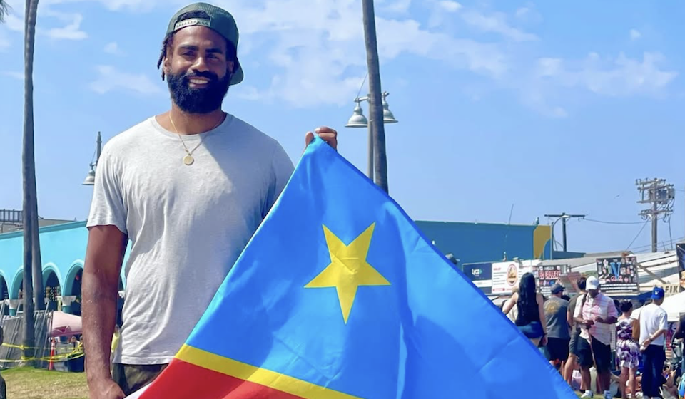 Image: Héritier Lumumba holding a DRC flag | instagram.com/hlumumba