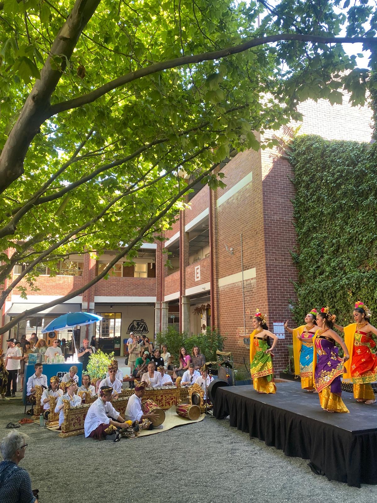 Image of women dancing before audience at Nongkrong festival