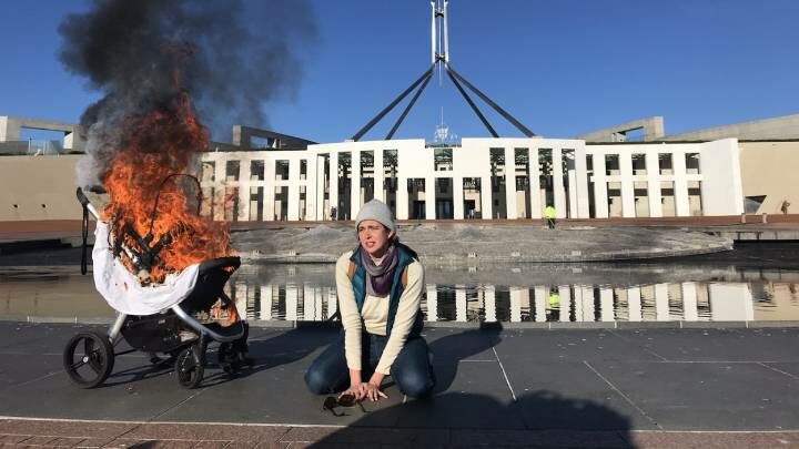 The Duty of Care rebellion burning the pram of future generations, Photo:Paul Gregoire