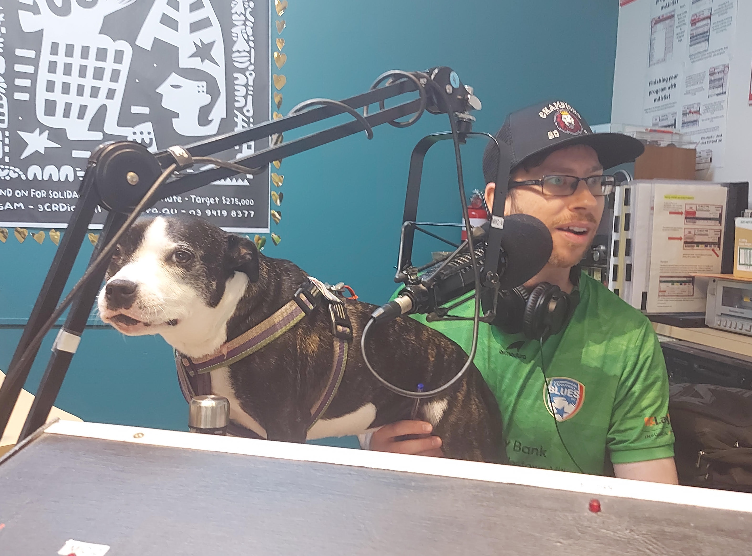 Photo of Nick and his dog Moo Moo in the studio