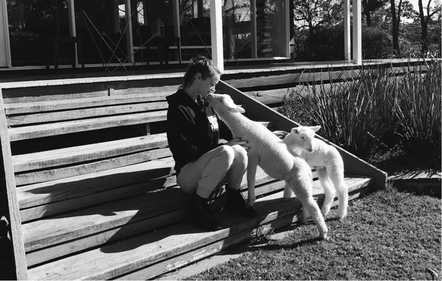 Emma and Willow the Sheep sitting on some stairs