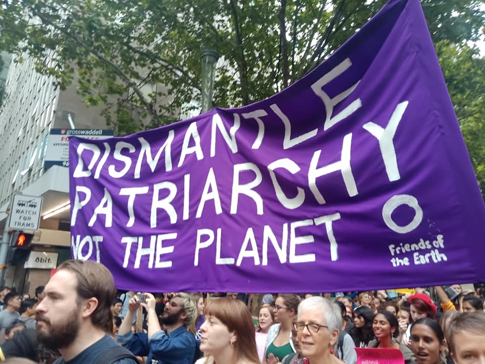 Protest - Banner reads "Dismantle Patriarchy Not the Planet"