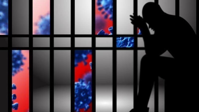 Person sitting in a cell with images of COVID-19 virus appearing through the cell bars