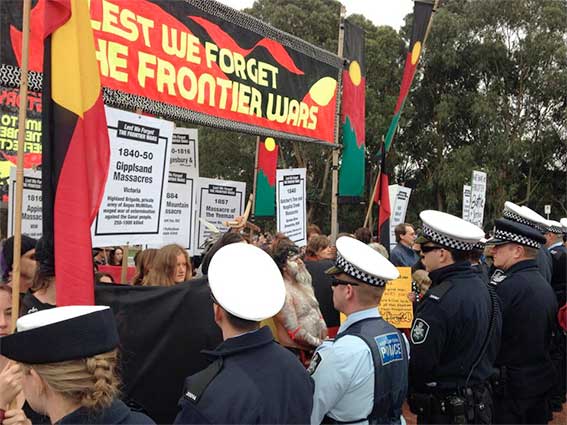 The Frontier Wars March meets a line of police at the Australian War Memorial