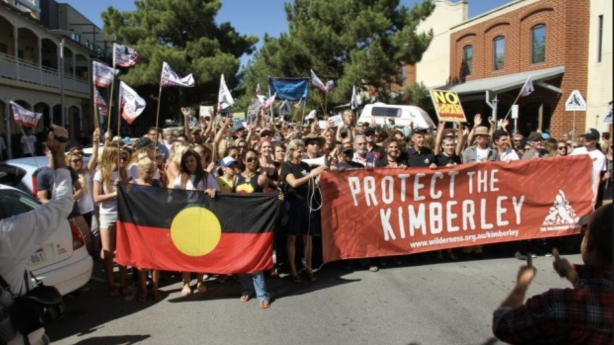 protest outside Buru office West Perth large with banners including Aboriginal flag