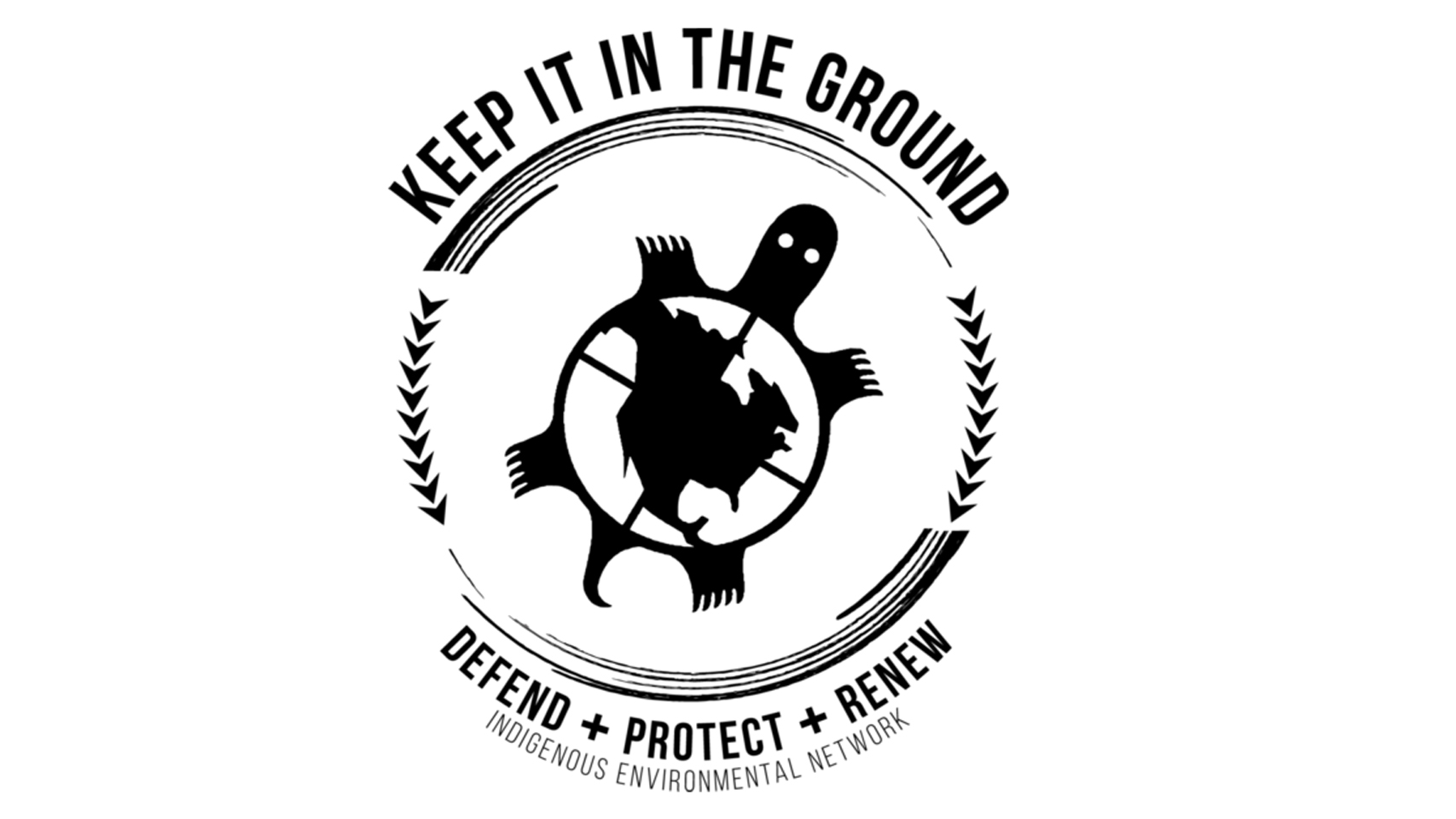 A black and white image of the Indigenous Environmental Network logo which depicts a turtle carrying north and central America on its back. Surrounded by a circular indigenous design with lines and arrowhead symbols—as well as the logo text, which says ‘Keep it in the ground. Defend + protect + renew. Indigenous Environmental.’ 