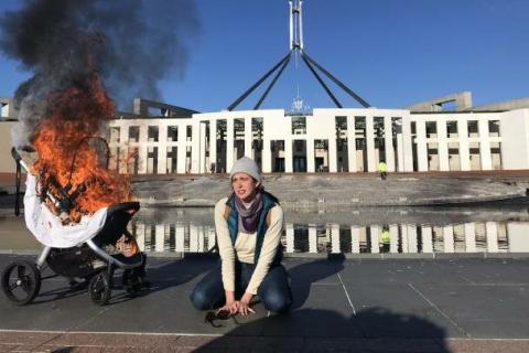 The Duty of Care rebellion burning the pram of future generations, Photo:Paul Gregoire