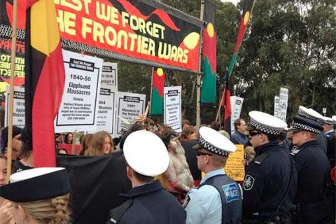 The Frontier Wars March meets a line of police at the Australian War Memorial