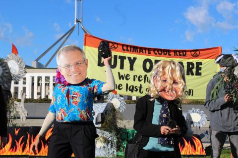 Protestors glued to the road