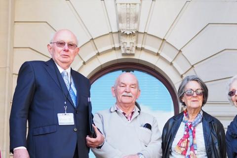 A group of retirement housing residents and advocates stand on the steps of Parliament House.